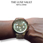 Michael Kors watch on a wrist with 'The Luxe Vault' branding.
